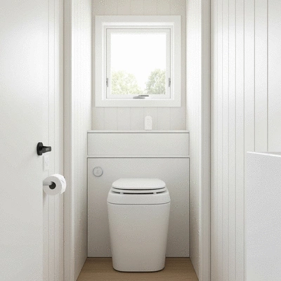 Modern composting toilet in a tiny home bathroom, clean, well-lit, with natural light